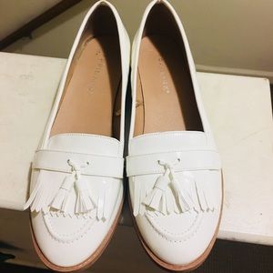White patent leather flats with tassels!